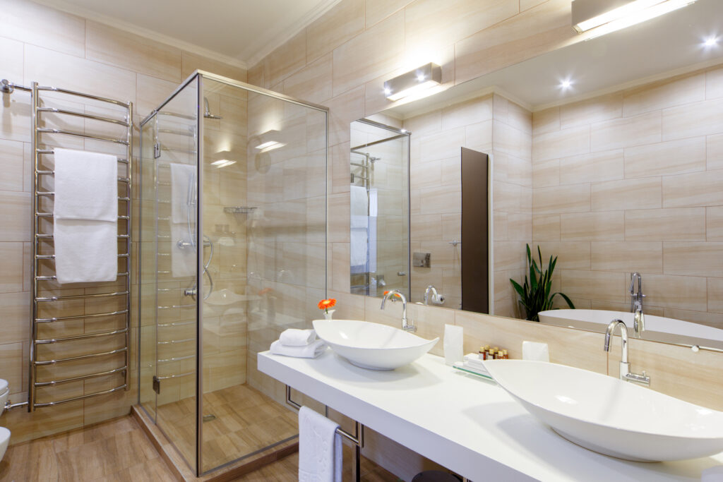 Modern bathroom with a glass shower and vessel sinks